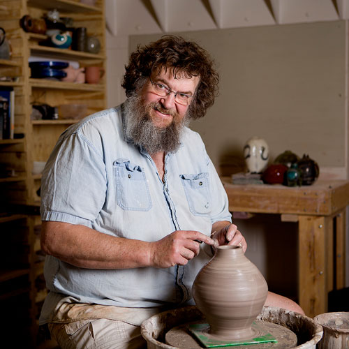 David McBeth at a pottery wheel in his studio
